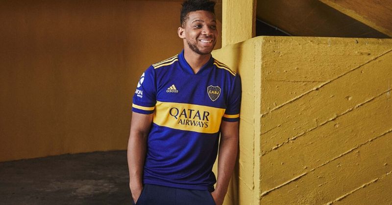player modelling the boca juniors 2020 home kit