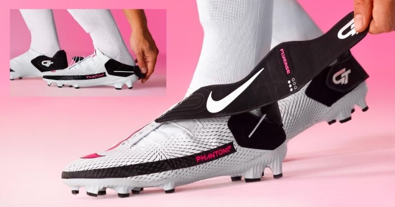 nike phantom gt academy flyease football boot in white on pink background