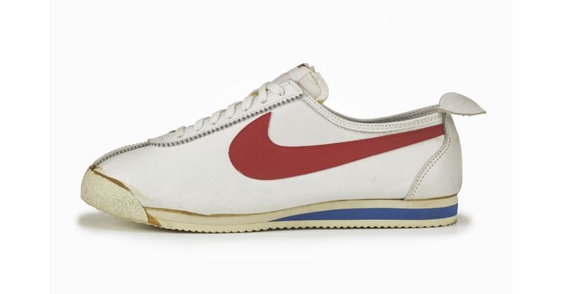 Nike Cortez 1972 original in white with red swoosh and blue detail on white background