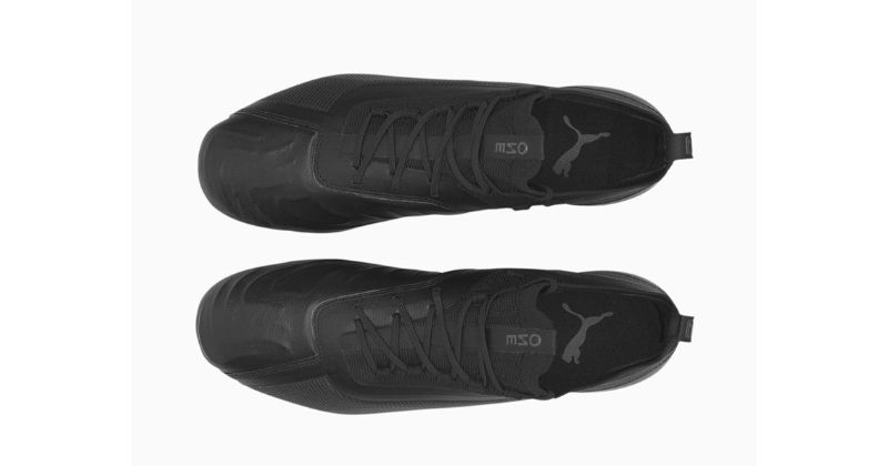 Puma One football boot from above in black on white background