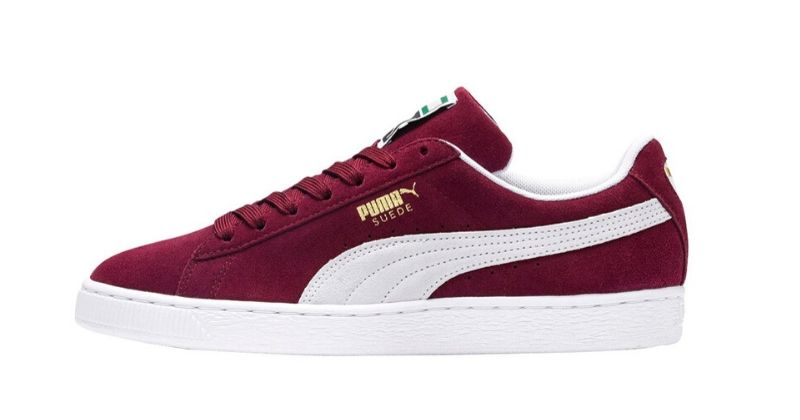 Puma Suede in red and white on white background