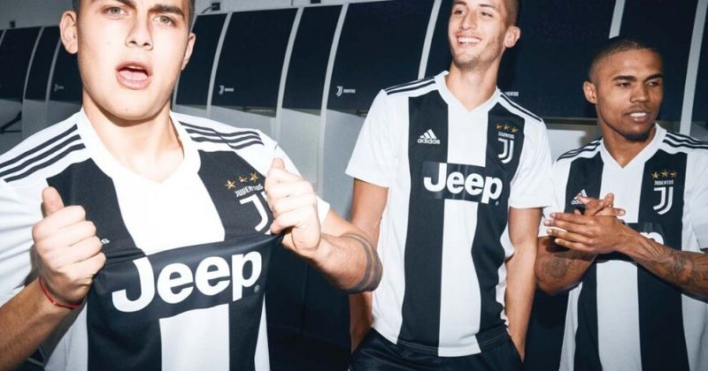 juventus players wearing their black and white 2018 home shirt