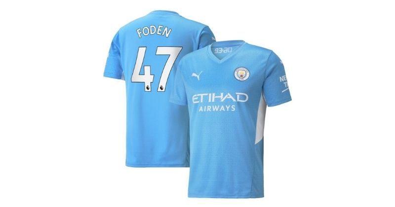 manchester city home shirt with foden in blue