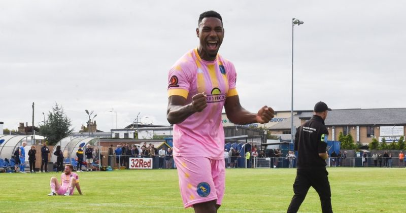 kings lynn town fc away shirt in pink and yellow