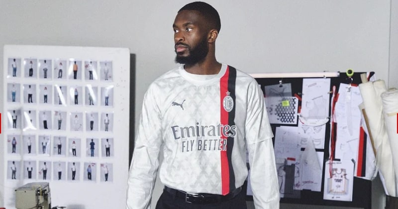 fikayo tomori wearing ac milan 2023-24 away shirt in white with red and black stripes