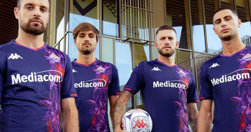 four players wearing fiorentina 2023-24 third shirt in purple