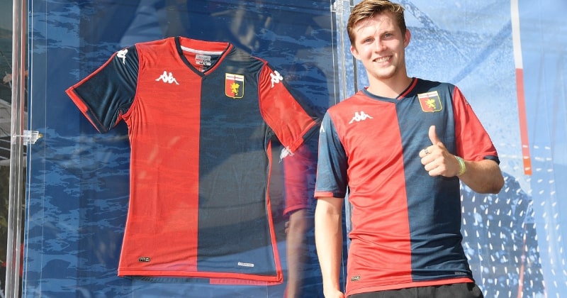 player wearing genoa 2023-24 home shirt in red and blue
