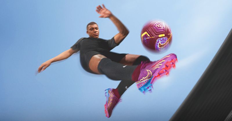 kylian mbappe wearing nike mercurial superfly 9 football boots in purple