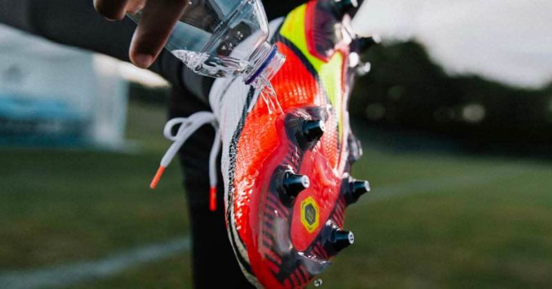 nike football boots in water being loosened