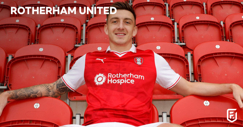 player wearing rotherham united 2023-24 home shirt in red and white