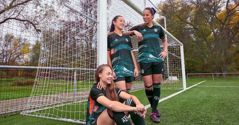 womens argentina away shirt 2023 in green and orange