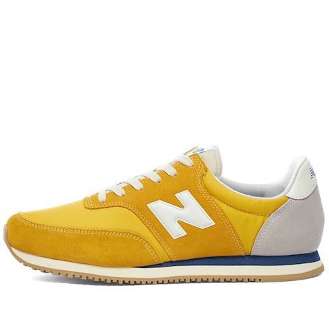 new balance comp 100 gold