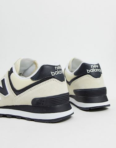 new balance 574 trainers in cream and black