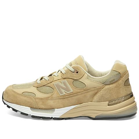 white and tan new balance shoes