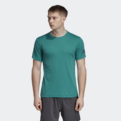 white and blue guess shirt