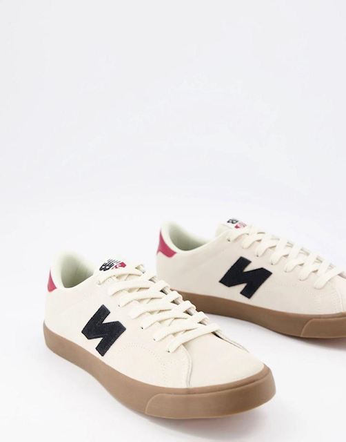 new balance 210 trainers in white with gum sole